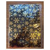 Six pieces of gold and black foil wrapping paper, two designs.