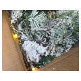 $46 2pk 6ft Pre-Lit Snow Flocked Christmas Garlands, 35 LED Lights
