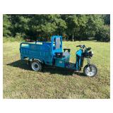 IRET Electric Tricycle:  I call these Tuk Tuks and they are very durable, fast and convenient.  Manual Dump Bed. Front Suspension and comes with Charger and Batteries. Not Assembled