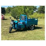 IRET Electric Tricycle:  I call these Tuk Tuks and they are very durable, fast and convenient.  Manual Dump Bed. Front Suspension and comes with Charger and Batteries. Not Assembled