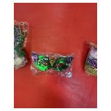 MArdi gras masquesrade masks and beads with coins