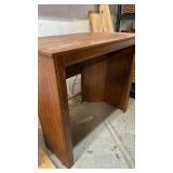 Wooden piece of furniture - not sure what used for.  32 inches tall, 36 inches wide and 20 inches deep at deepest spot and a furniture cover