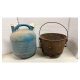Vintage Cast Iron Footed Bean Pot and an empty kerosine jug