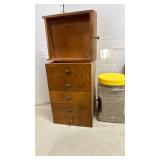 Six small drawers, cat litter (?) and a Clock