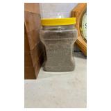 Six small drawers, cat litter (?) and a Clock