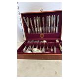 Mismatched flatware in wooden box
