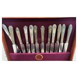 Mismatched flatware in wooden box