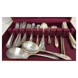 Mismatched flatware in wooden box