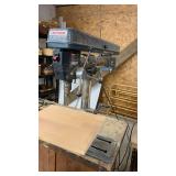 Craftsman 34-inch Radial Drill Press attached to workbench 32x60 ( needs cleaned) also with vise attached.
