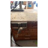 Craftsman 34-inch Radial Drill Press attached to workbench 32x60 ( needs cleaned) also with vise attached.
