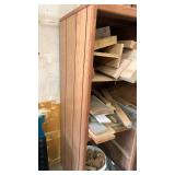 Wooden shelving unit filled with misc wood 64x21x25