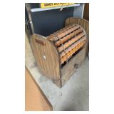 Vintage electric wooden roller massager, often referred to as a Sears roller massager. These devices were popular in the 1970s and were marketed for various health and wellness benefits