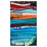 Fabric , green, blue, orange spider web and more in bin