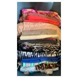 Fabrics, pinks, black and white tie dye and more in bin