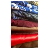 Fabrics, mostly dark, paisley and blue and white flowers