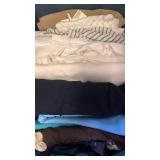 Fabrics, whites, brown, blues in bin