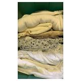 Fabrics, whites and beiges in bin