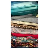 Fabrics includind plaid, check, solid and animal print, felt squares  in bin