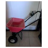 Red Push Broadcast Spreader with Pneumatic Wheels