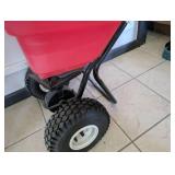 Red Push Broadcast Spreader with Pneumatic Wheels