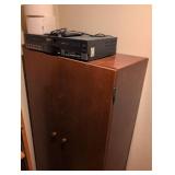 Go Video Dual VHS Player/Recorder with cabinet and contents