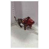 African folk art lion sculpture made from tin and painted with vibrant colors and patterns 5x10
