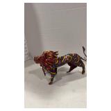 African folk art lion sculpture made from tin and painted with vibrant colors and patterns 5x10