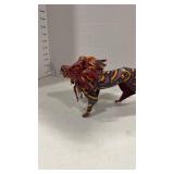 African folk art lion sculpture made from tin and painted with vibrant colors and patterns 5x10