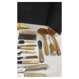 Wooden and wooden handled kitchen utensils