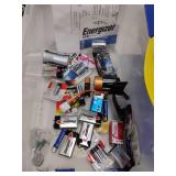 Assorted Batteries in Storage Tote