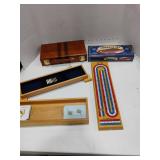 Games.  Cribbage Games and a Multi Travel Game Set.  Set has Chess, Dominoes and More