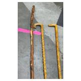 Wooden carved walking sticks tallest is 48 inches