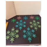 Vintage blue, green, pink plastic snowflake ornaments, at least 70 years old, 4 and 8in width, total of 9, one small green has loose piece.