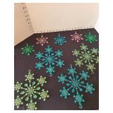Vintage blue, green, pink plastic snowflake ornaments, at least 70 years old, 4 and 8in width, total of 9, one small green has loose piece.