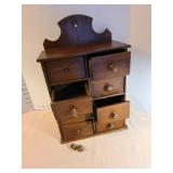 Primitive antique wooden eight drawer spice chest, 16x10.5x5.5. Two loose knobs included.