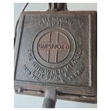 Antique Griswold Cast Iron Waffle Maker No. 11 in well-preserved condition.