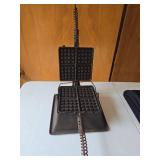 Antique Griswold Cast Iron Waffle Maker No. 11 in well-preserved condition.