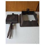 Antique Griswold Cast Iron Waffle Maker No. 11 in well-preserved condition.