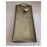 Vintage oriental brass serving tray with etched garden scene and a small brass bird