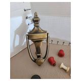 Brass doorknocker, old knobs, lamp harps, more.