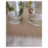 Two 1973 Warner Bros collector glasses and a stainless steel utensil holder