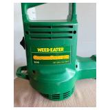 Electric Weed Eater brand ground sweeper.