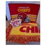 KC Chiefs throw blanket, small rug, brick sofa-style doorstop