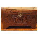 Early 20th Century beautiful hand-carved Asian camphor wood trunk with brass latch, 19x35x17. Latch needs minor repair.