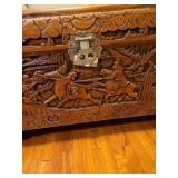 Early 20th Century beautiful hand-carved Asian camphor wood trunk with brass latch, 19x35x17. Latch needs minor repair.