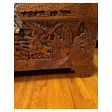 Early 20th Century beautiful hand-carved Asian camphor wood trunk with brass latch, 19x35x17. Latch needs minor repair.