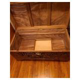 Early 20th Century beautiful hand-carved Asian camphor wood trunk with brass latch, 19x35x17. Latch needs minor repair.