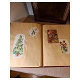 Two scrapbooks with vintage greeting card fronts