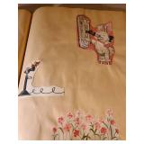 Two scrapbooks with vintage greeting card fronts