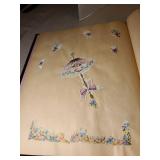 Two scrapbooks with vintage greeting card fronts